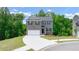 Charming two-story home featuring a combination of brick and siding, a two-car garage, and a well-manicured lawn at 1416 Clear Pond Lane, Dacula, GA 30019