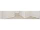 Neutral hallway with carpeted floors and white walls, next to closed closet door at 1416 Clear Pond Lane, Dacula, GA 30019