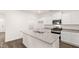 Kitchen island with sink and white cabinets at 1416 Clear Pond Lane, Dacula, GA 30019