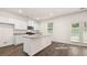 Modern kitchen with white cabinets, granite countertops, and stainless steel appliances at 1416 Clear Pond Lane, Dacula, GA 30019