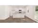 A bright, open kitchen features granite countertops and stainless steel appliances at 1416 Clear Pond Lane, Dacula, GA 30019