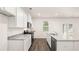 Bright kitchen featuring granite countertops, stainless appliances, and ample cabinet space at 1416 Clear Pond Lane, Dacula, GA 30019