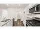 Kitchen with granite countertops, stainless steel appliances, and pantry at 1416 Clear Pond Lane, Dacula, GA 30019