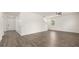 Open-concept living room with wood-look floors, high ceilings, and natural light at 1416 Clear Pond Lane, Dacula, GA 30019