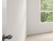 Room with carpet, white walls, window, and closed door at 1416 Clear Pond Lane, Dacula, GA 30019