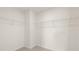 Empty walk-in closet featuring white wire shelving for storage at 1416 Clear Pond Lane, Dacula, GA 30019