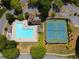 Aerial view of a community pool and tennis courts, highlighting recreational amenities for residents at 150 Park Creek Dr, Alpharetta, GA 30005