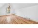 Large bedroom with light hardwood floors, a window and white walls at 150 Park Creek Dr, Alpharetta, GA 30005