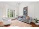 Elegant living room with high ceilings, decorative molding, and lots of natural light at 150 Park Creek Dr, Alpharetta, GA 30005