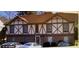 Charming two-story home with brick facade and Tudor-style accents at 3231 Abbeywood Dr, Decatur, GA 30034