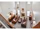 Stunning living room with soaring ceilings, fireplace, hardwood floors and abundant natural light at 6330 Beaver Crossing Dr, Cumming, GA 30040