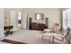 Serene main bedroom with sitting area and large windows, providing a tranquil retreat at 6330 Beaver Crossing Dr, Cumming, GA 30040