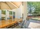 Outdoor patio with large wooden table and seating area, perfect for entertaining at 6330 Beaver Crossing Dr, Cumming, GA 30040
