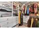Spacious walk-in closet with custom shelving and hanging rods for optimal organization at 6330 Beaver Crossing Dr, Cumming, GA 30040