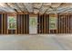 Spacious unfinished basement with exposed ceiling and walkout door at 110 Slate Ridge Ln, Loganville, GA 30052