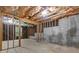 Unfinished basement with exposed ceiling and concrete walls at 110 Slate Ridge Ln, Loganville, GA 30052