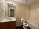 Bathroom featuring a shower-tub combo and vanity with good lighting at 110 Slate Ridge Ln, Loganville, GA 30052