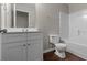 Bathroom features updated vanity, mirror and a shower with a tub at 110 Slate Ridge Ln, Loganville, GA 30052