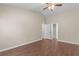 Bedroom featuring wood-look floors and an open door that leads to the bathroom at 110 Slate Ridge Ln, Loganville, GA 30052
