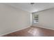 Cozy bedroom features hardwood floors and natural light from a window at 110 Slate Ridge Ln, Loganville, GA 30052