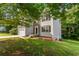 Two-story home with stone accents, two-car garage, and lush green lawn for an inviting curb appeal at 110 Slate Ridge Ln, Loganville, GA 30052