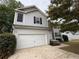 Charming two-story home with a two-car garage and stone accents at 110 Slate Ridge Ln, Loganville, GA 30052