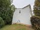 Exterior of home with light gray siding and a private backyard space at 110 Slate Ridge Ln, Loganville, GA 30052