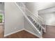 Foyer features beautiful wood flooring, a staircase with white railings, and a bright, open feel at 110 Slate Ridge Ln, Loganville, GA 30052
