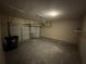 Two car garage with neutral walls and concrete floors for parking and storage at 110 Slate Ridge Ln, Loganville, GA 30052