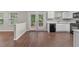 Bright kitchen featuring a deck view through glass doors and updated stainless steel appliances at 110 Slate Ridge Ln, Loganville, GA 30052