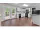 Bright kitchen with stainless steel appliances and a view of the deck through glass doors at 110 Slate Ridge Ln, Loganville, GA 30052