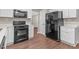 Updated kitchen with stainless steel appliances, white cabinets and granite counters at 110 Slate Ridge Ln, Loganville, GA 30052