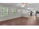 Open concept living room and kitchen with wood floors and natural light at 110 Slate Ridge Ln, Loganville, GA 30052