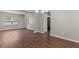 The home features a combined dining and living room area with beautiful new wood flooring at 110 Slate Ridge Ln, Loganville, GA 30052