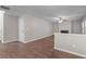 Neutral living room featuring a fireplace, wood floors, and staircase access at 110 Slate Ridge Ln, Loganville, GA 30052