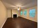 Spacious living room featuring a fireplace and laminate flooring at 110 Slate Ridge Ln, Loganville, GA 30052