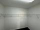Spacious walk-in closet with ample shelving and dark flooring at 110 Slate Ridge Ln, Loganville, GA 30052