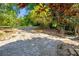 Expansive backyard with lush greenery, mature trees, and a stone paver path at 821 Ralph Mcgill Ne Blvd # 3325, Atlanta, GA 30306