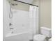Well-lit bathroom showcasing a shower-tub combo with white tiled walls at 821 Ralph Mcgill Ne Blvd # 3325, Atlanta, GA 30306