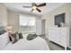 Comfortable bedroom boasting bright windows, ceiling fan, and adjacent ensuite bathroom at 821 Ralph Mcgill Ne Blvd # 3325, Atlanta, GA 30306