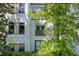 Close up view of a building's exterior, showcasing windows and balconies with lush foliage at 821 Ralph Mcgill Ne Blvd # 3325, Atlanta, GA 30306