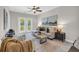 Bright living room with a ceiling fan and glass doors that lead to a balcony at 821 Ralph Mcgill Ne Blvd # 3325, Atlanta, GA 30306