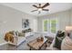 Cozy living room with a ceiling fan, a comfortable sofa, and access to a balcony at 821 Ralph Mcgill Ne Blvd # 3325, Atlanta, GA 30306
