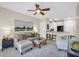 Bright living room featuring a ceiling fan, neutral paint, and a comfortable gray sofa and seating area at 821 Ralph Mcgill Ne Blvd # 3325, Atlanta, GA 30306