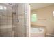 Bathroom featuring walk-in shower and soaking tub at 2980 Milford Sw Trl, Marietta, GA 30008