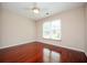 Bedroom with ceiling fan, neutral walls and wood flooring at 2980 Milford Sw Trl, Marietta, GA 30008