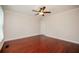 Large bedroom with hardwood floors, a ceiling fan, and natural light at 2980 Milford Sw Trl, Marietta, GA 30008