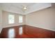 Spacious bedroom with trey ceiling, wood floors, and windows at 2980 Milford Sw Trl, Marietta, GA 30008