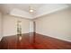 Large bedroom with wood floors and adjoining bathroom at 2980 Milford Sw Trl, Marietta, GA 30008