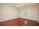 Bright bedroom featuring hardwood floors and a ceiling fan at 2980 Milford Sw Trl, Marietta, GA 30008